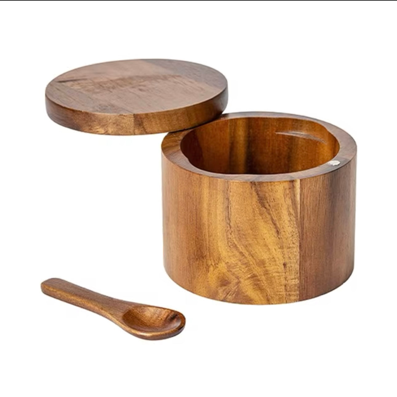 Wooden container with a lid and spoon on a white background
