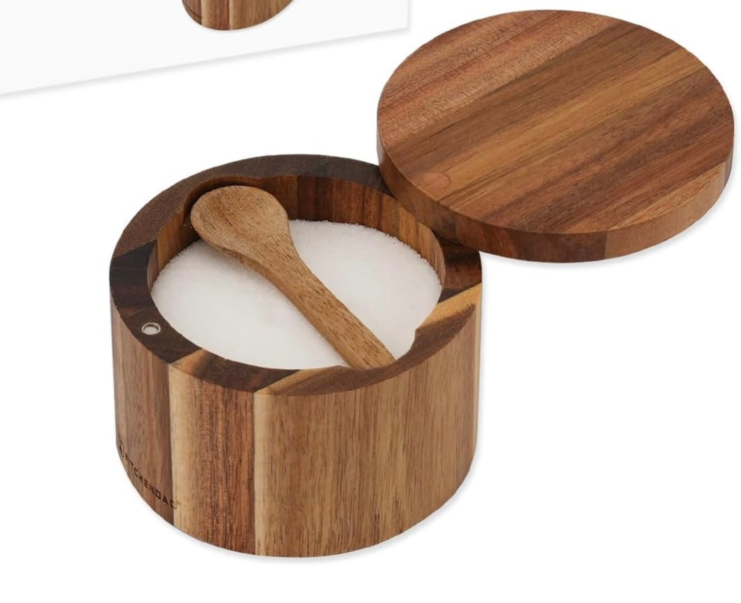 Wooden container with a wooden spoon inside on a white background