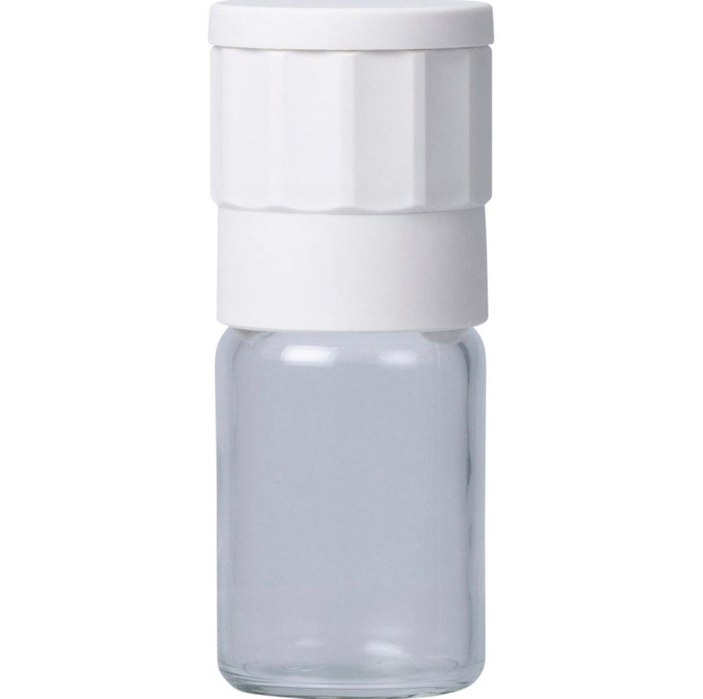 Glass container with a white lid on a white background