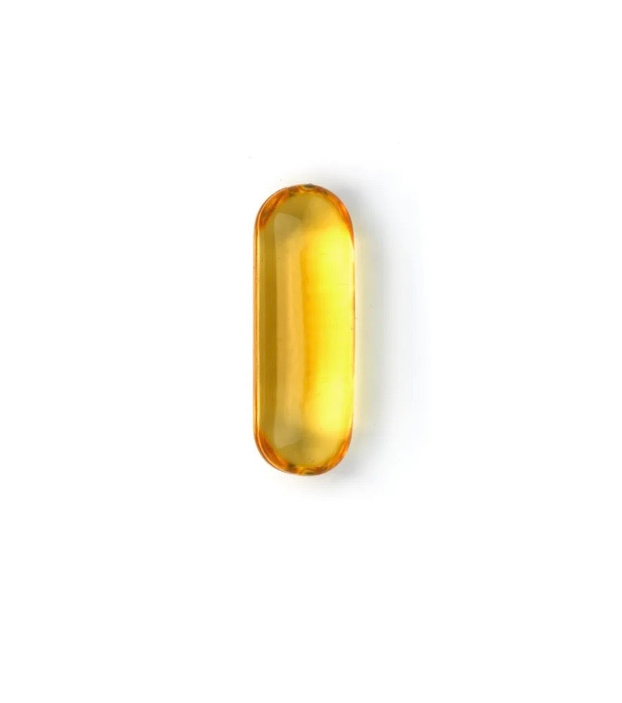 A single translucent yellow-orange oval capsule or gel cap centered on a plain white background.