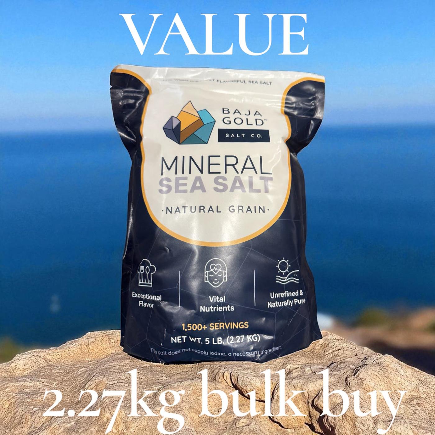 Bag of 2.27kg Baja Gold Mineral Sea Salt on a rock with ocean view