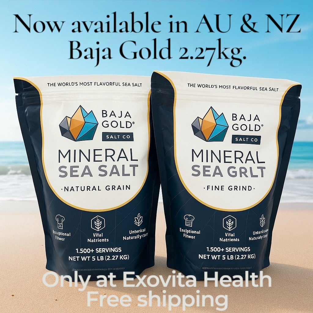 Two packages of Baja Gold Mineral Sea Salt on a beach with text about availability and free shipping.